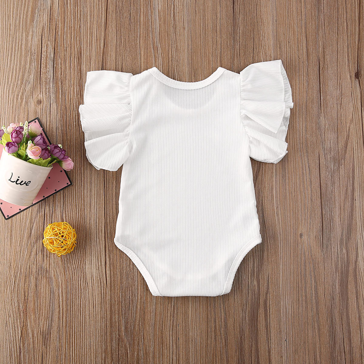 Newborn/Toddler Body Suit with ruffled sleeves